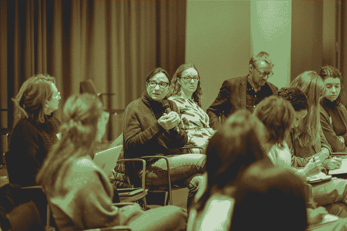 An audience member asking a question to the panel